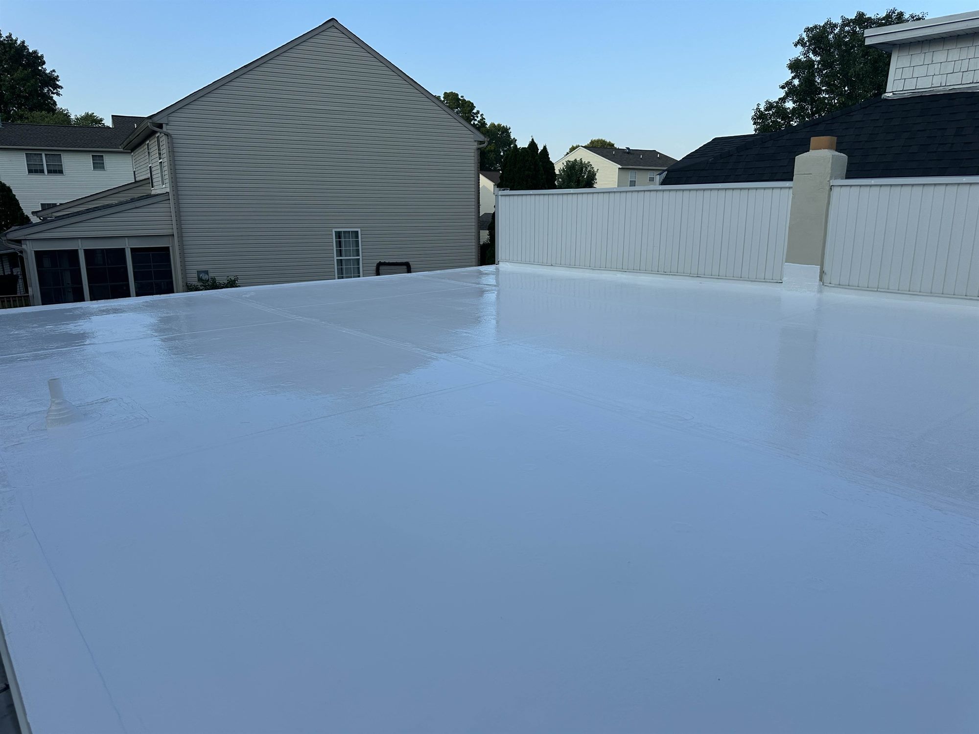 Douglassville PA residential flat roof after white silicone coating
