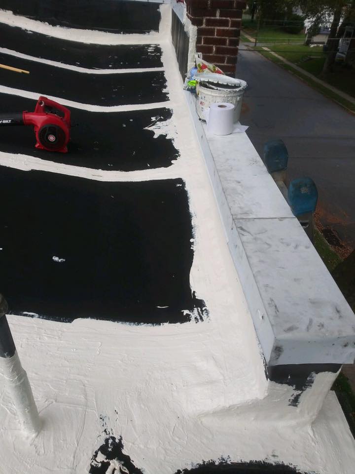 Polyester fabric reinforcement embedded in silicone over EPDM seams on the Reading, PA roof