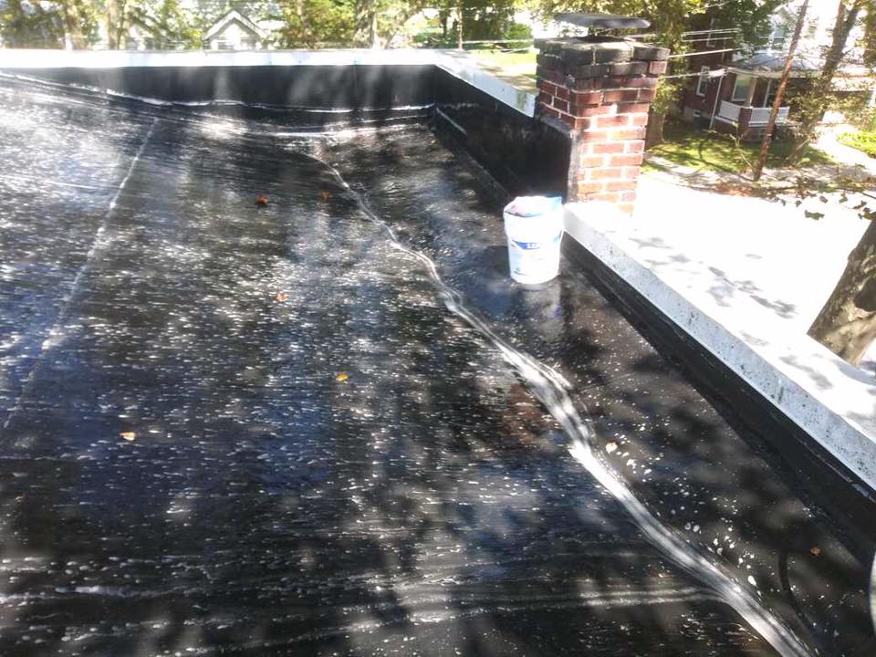 Pressure-washing an EPDM roof before silicone coating