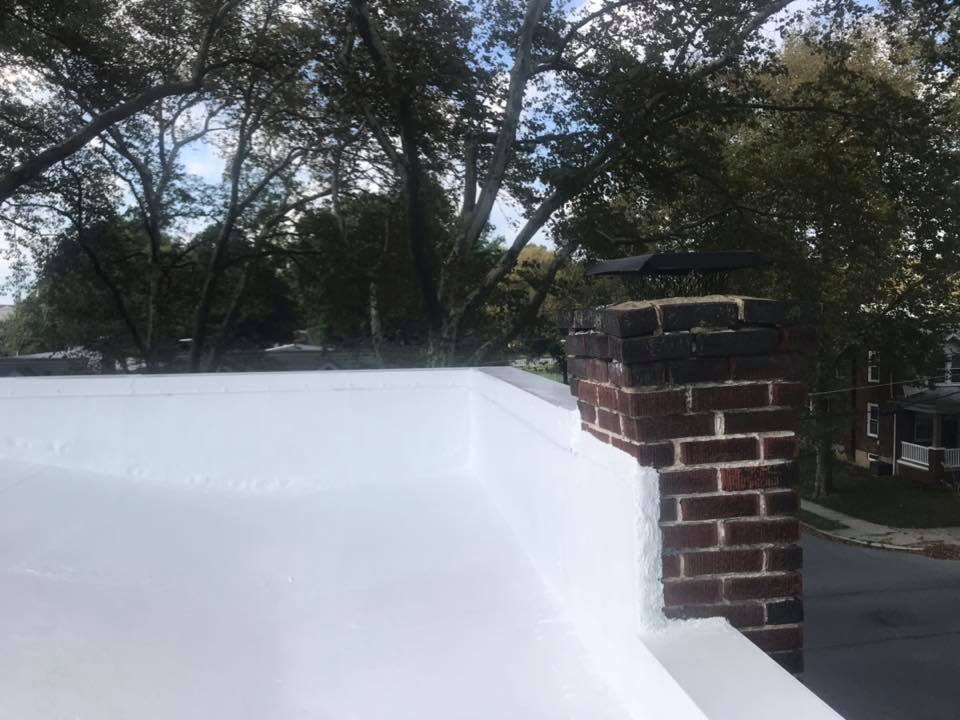 The same Reading, PA roof finished in bright white silicone after restoration