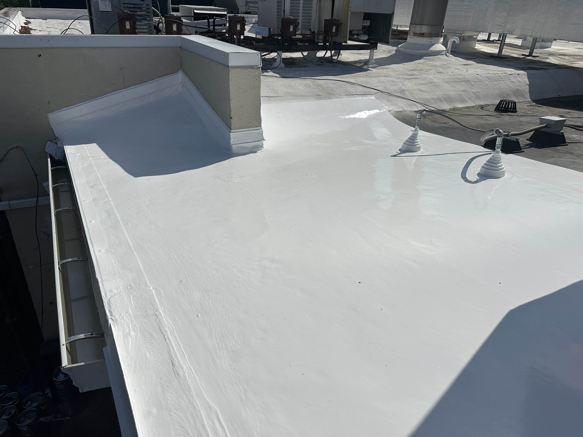 Clean, well-maintained white silicone commercial flat roof