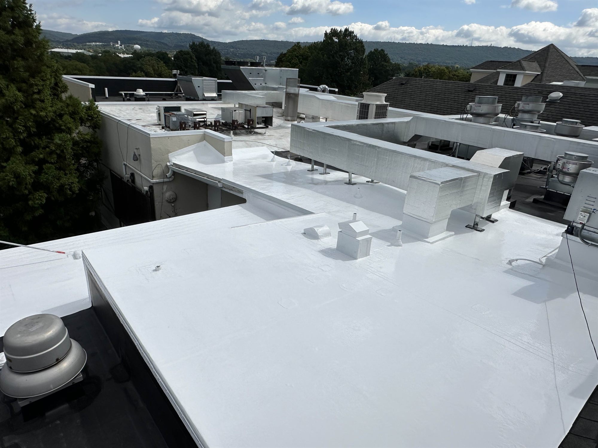 Reading PA commercial flat roof after bright white silicone coating