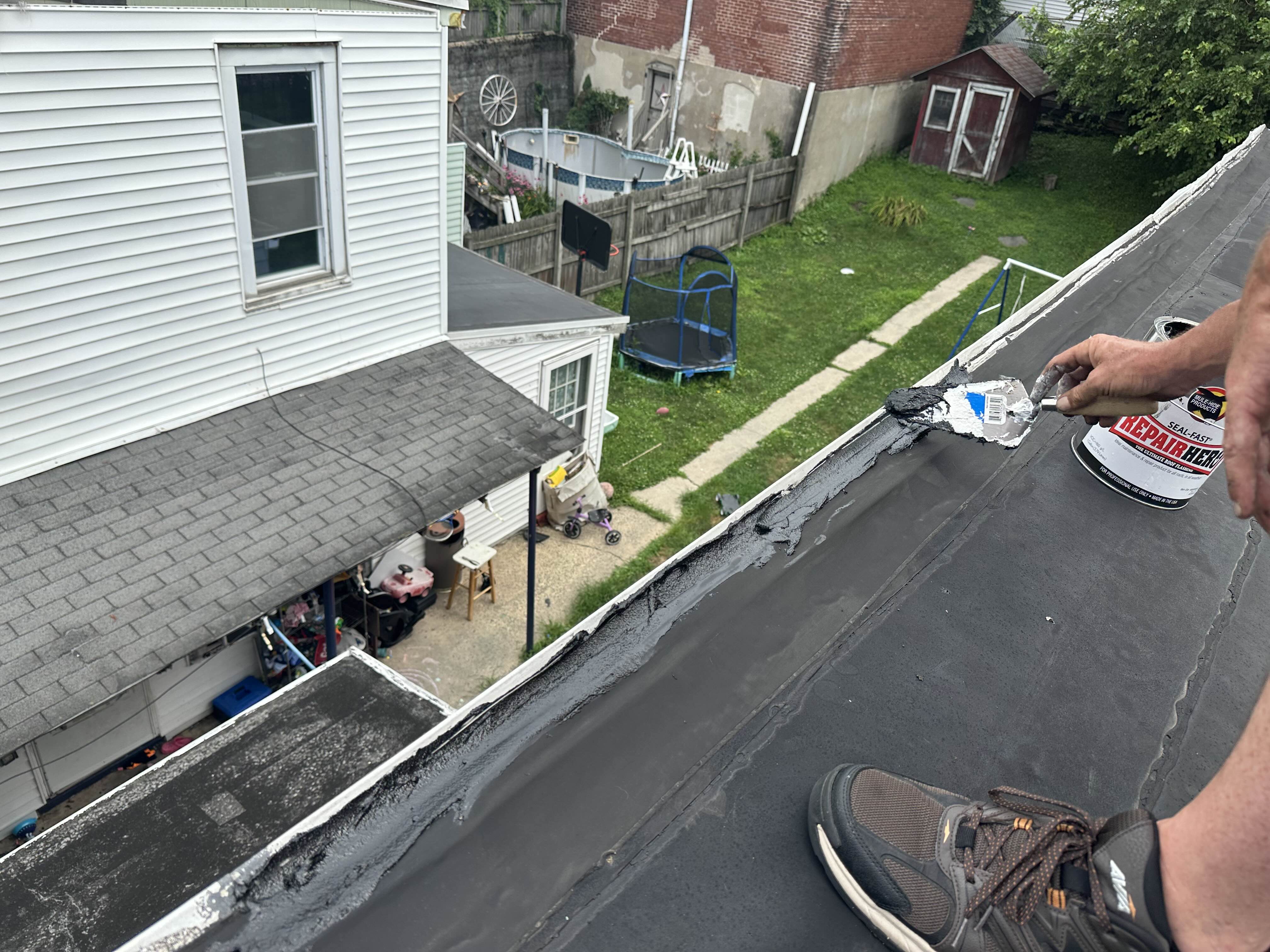 Sealing a parapet edge with Seal-Fast repair mastic